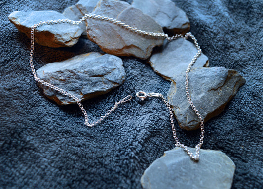 Elegant silver necklace by Dela Comeco, showcasing a sleek and refined design, handcrafted in Bridgend, South Wales.