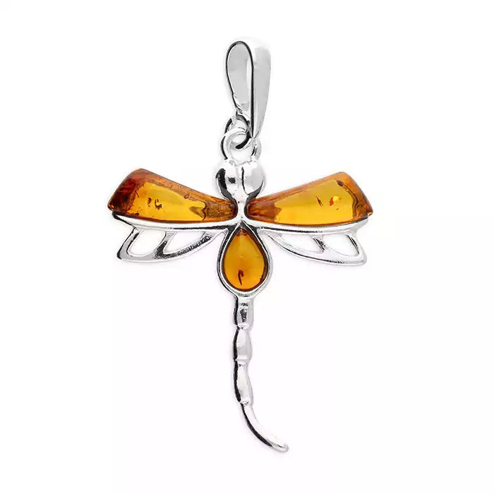 Dragonfly-shaped amber pendant on a white background