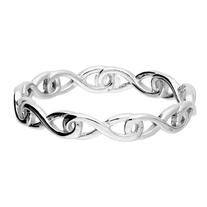Silver ring with a wavy design on a white background