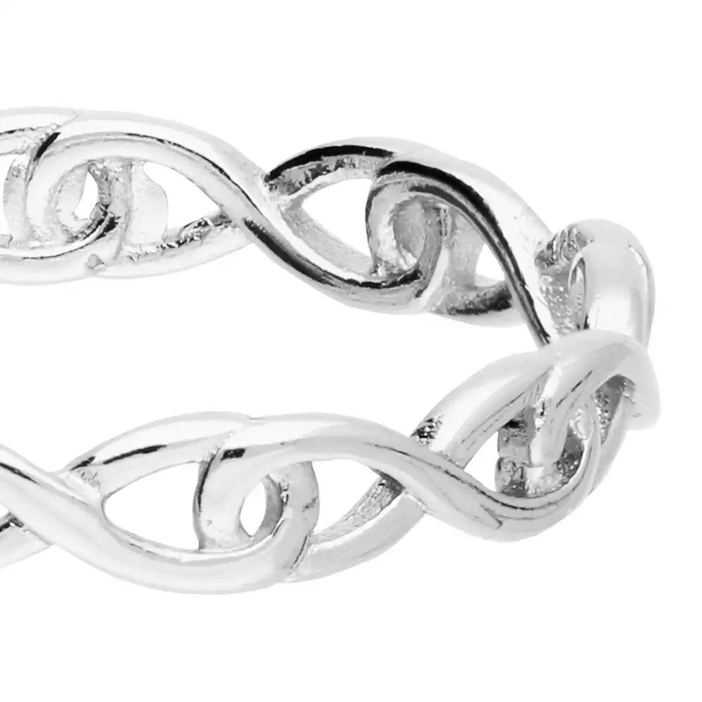 Silver ring with intricate design on a white background