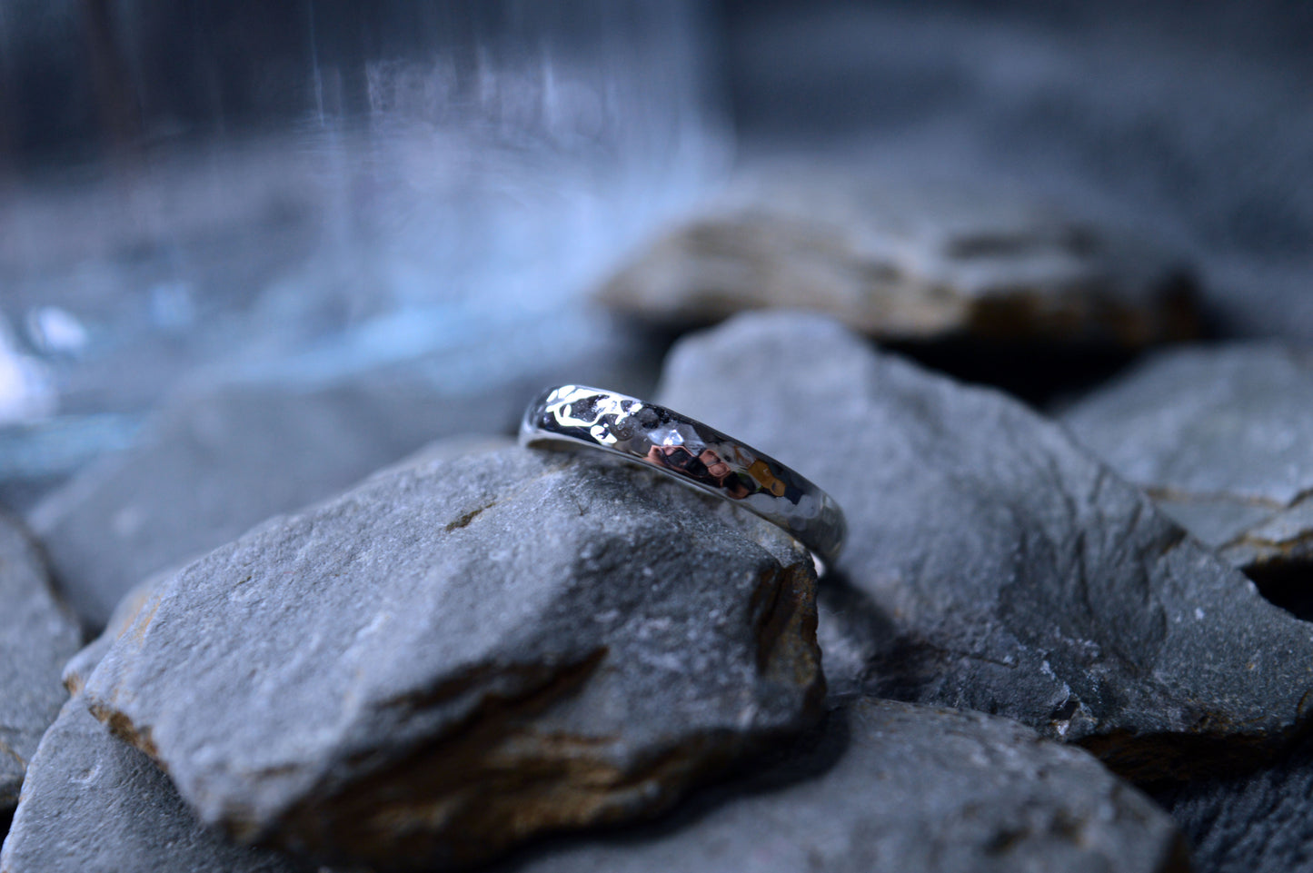 Sterling silver ring featuring a hammered finish, displaying the artisanal craftsmanship of Dela Comeco.