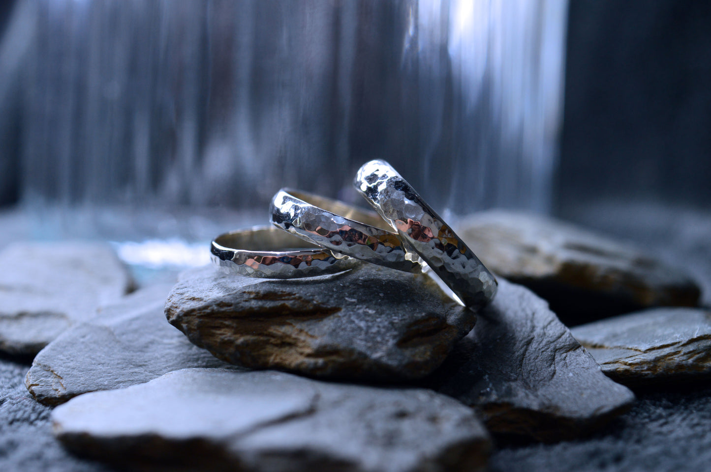 Handmade 925 sterling silver ring with medium-width band, showcasing an exclusive hammered pattern.