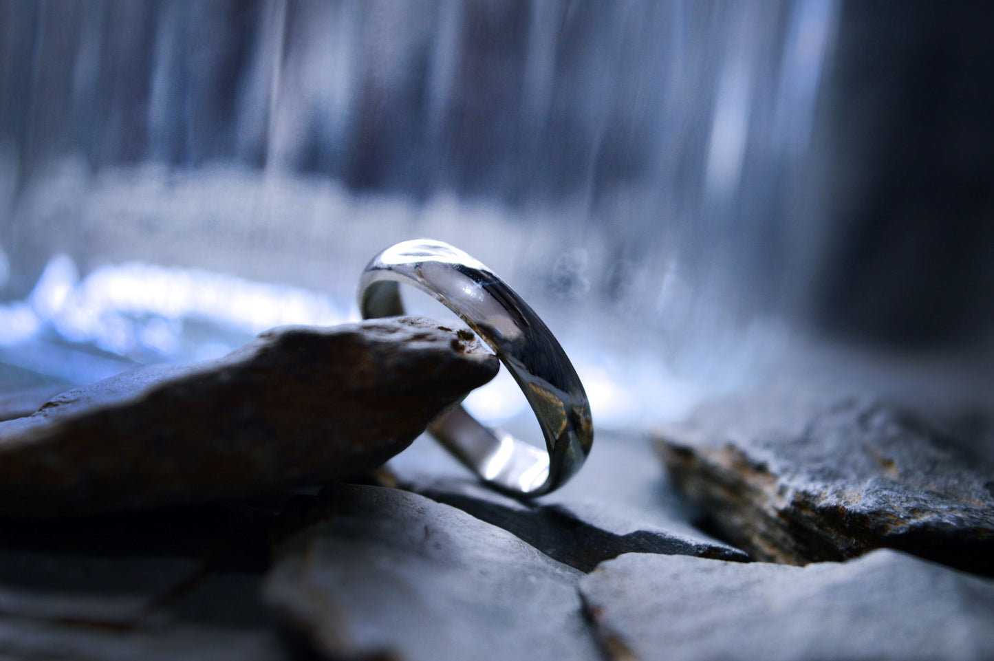 A handcrafted sterling silver wedding band with a smooth finish and traditional half-round design. The 5mm wide and 2mm thick ring is perfect for weddings or special occasions.