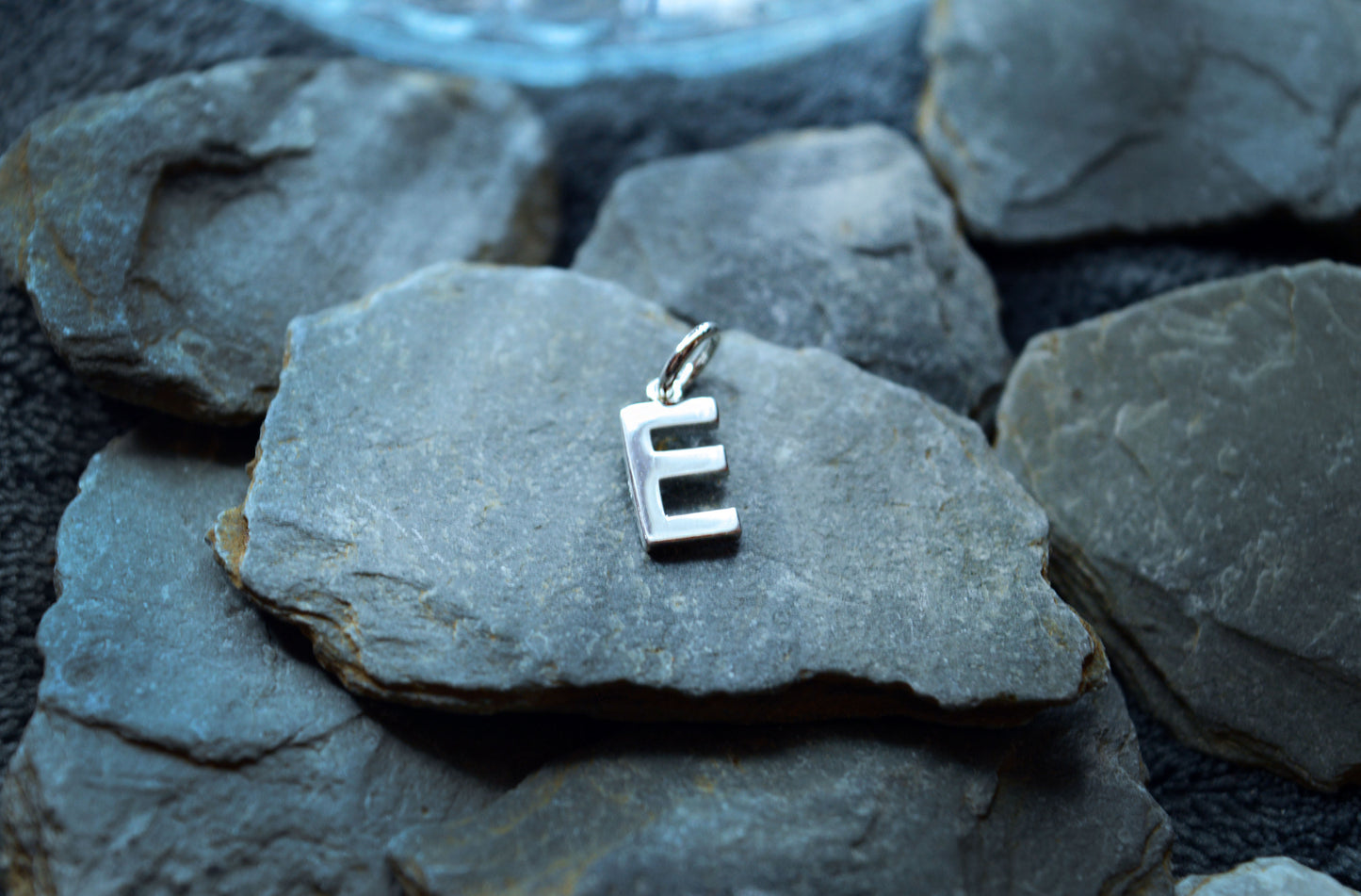 Handcrafted 925 sterling silver initial pendant, featuring a 1.5mm thick letter with a 3.5mm internal loop.