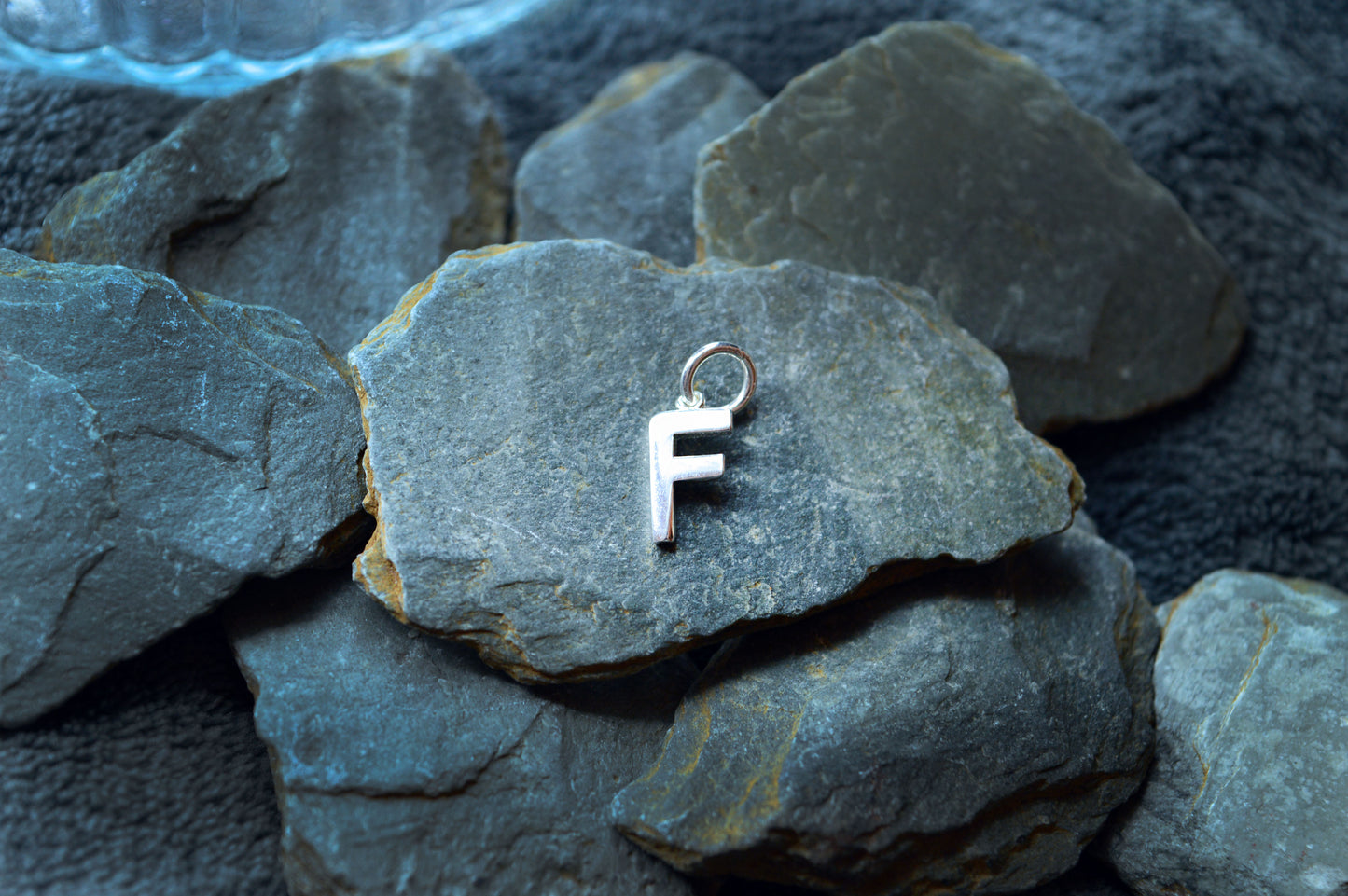 Personalized sterling silver initial pendant, designed with a pre-looped hole to fit necklaces up to 3mm thick.