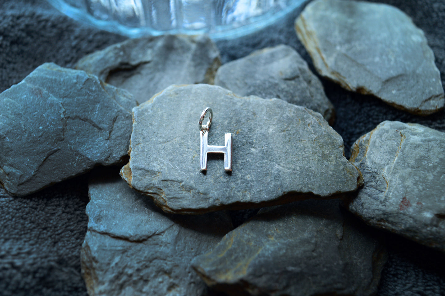 Close-up of a 925 sterling silver initial pendant with a 3.5mm loop, designed for slim necklace chains.