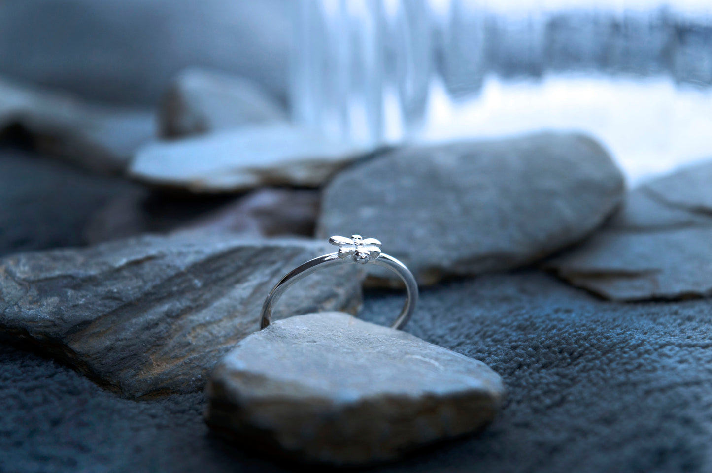 Dainty silver bee stacking ring. The ring is set in 925 silver with a small bee detail on top, creating this unique look.