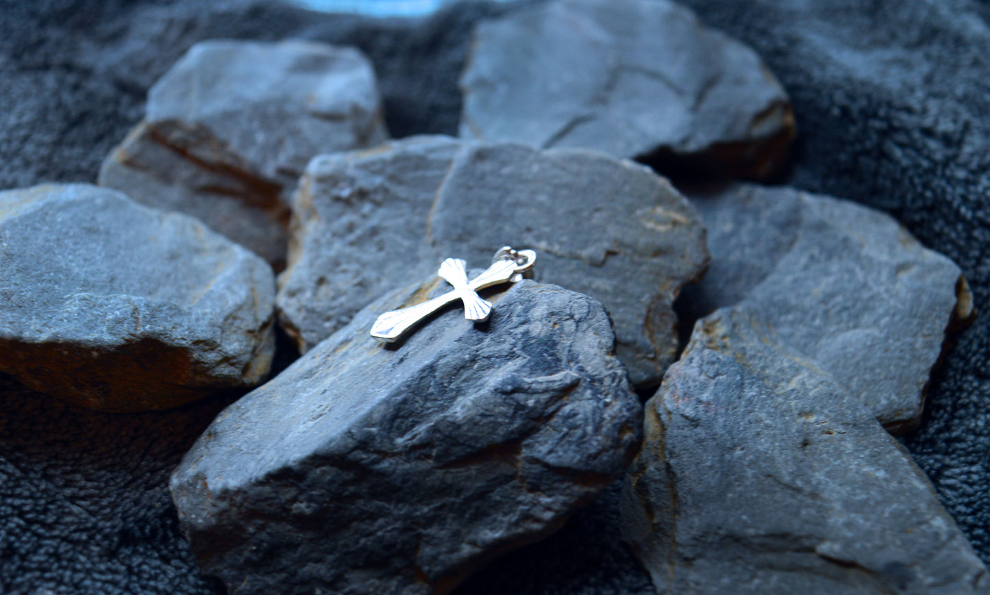 Sterling silver cross pendant, cut effect on the face to create a unique look.