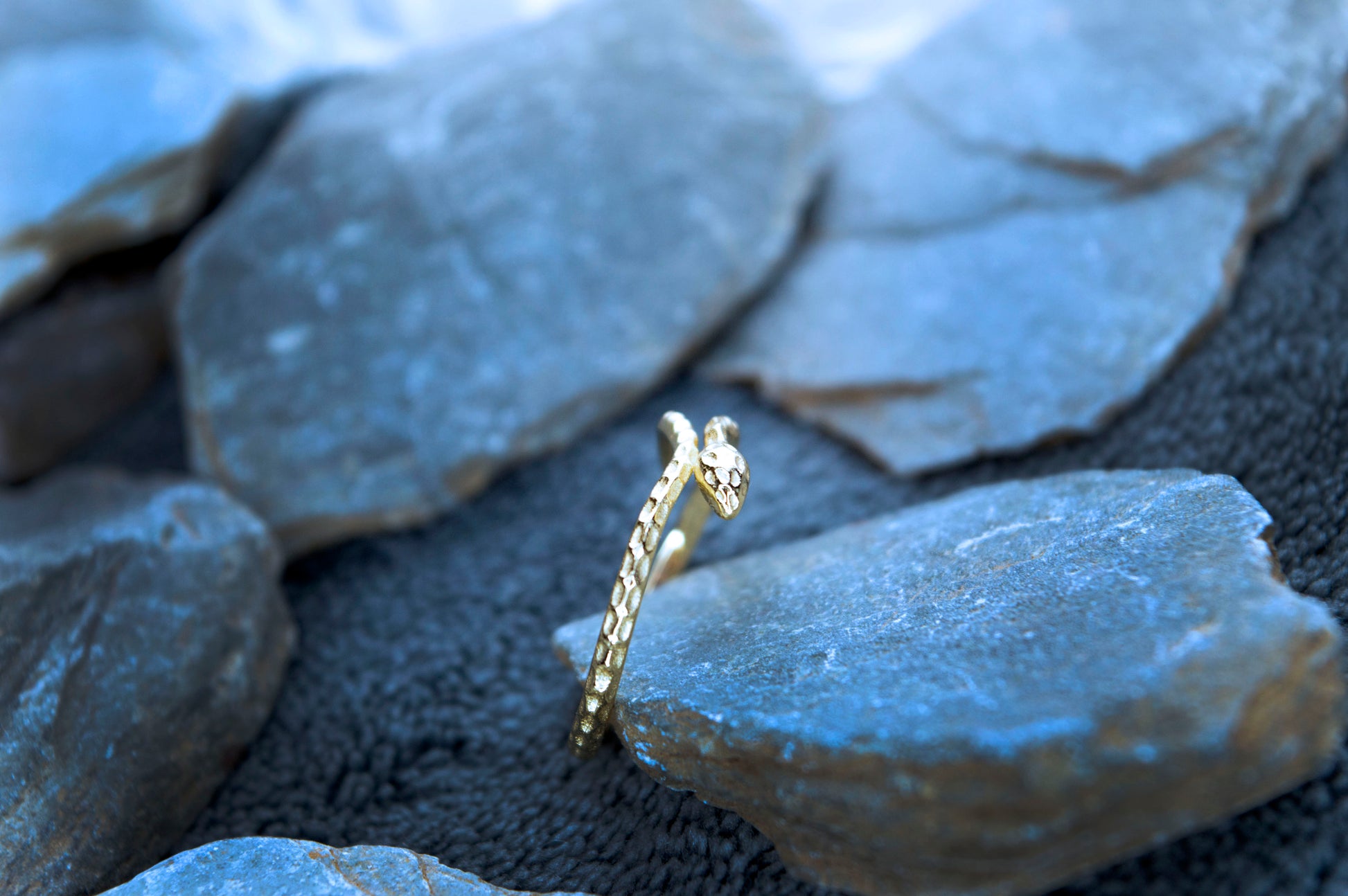 Elegant 14ct gold-plated snake ring, crafted from 925 sterling silver with a minimalist design. The adjustable band features a gracefully coiled snake motif.