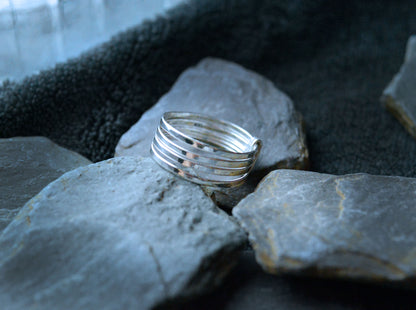 925 silver ring. Four bands joined together to create this unique piece. 