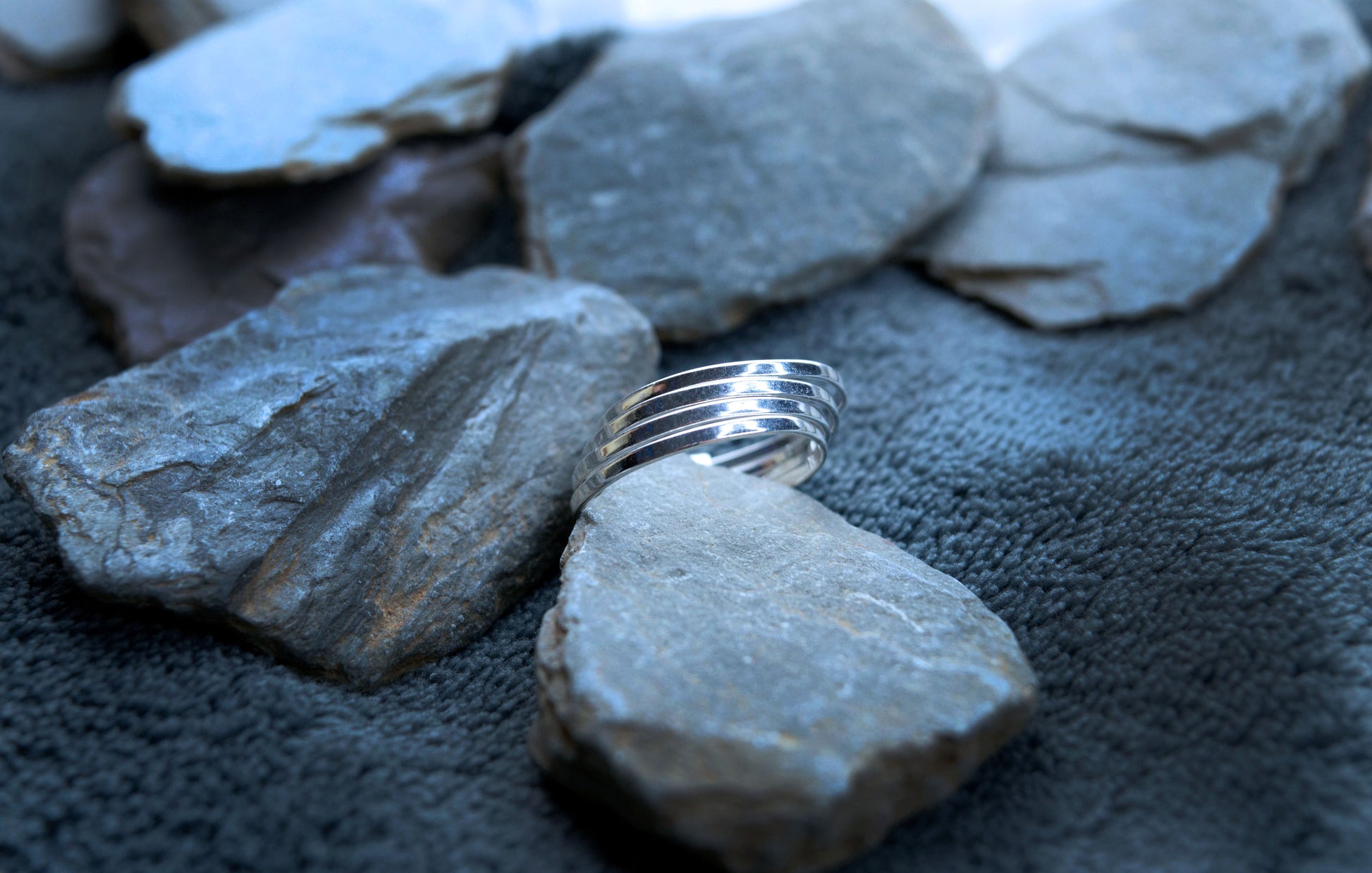 Sterling silver stacking ring. Four bands joined together with a small silver coupling. This enables the rings to move but not come apart.