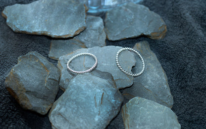 Thin silver stcking rings. They are 1mm twisted band, set in 925 silver.